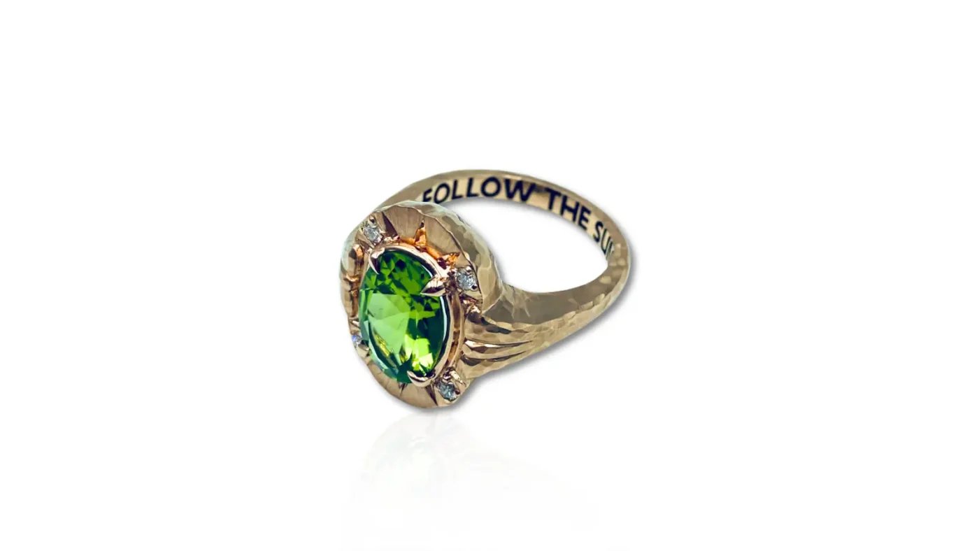 Lisa Messenger’s gold Follow the Sun ring with an oval peridot centre stone